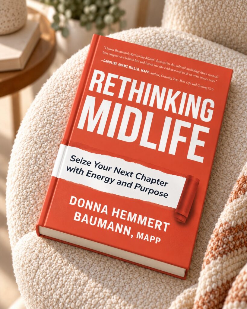 Rethinking Midlife by Donna Hemmert Baumann, MAPP, on a cozy armchair